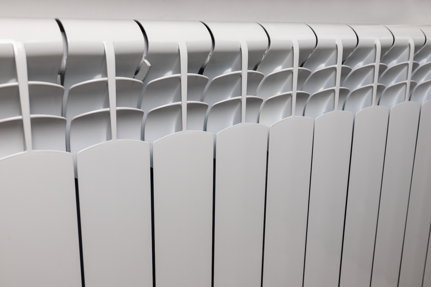 Central,Heating,System.,Modern,Radiator,On,White,Wall,Indoors.