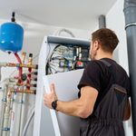 Technician,Open,Control,Panel,With,Internal,Wiring,To,Inspecting,Heat